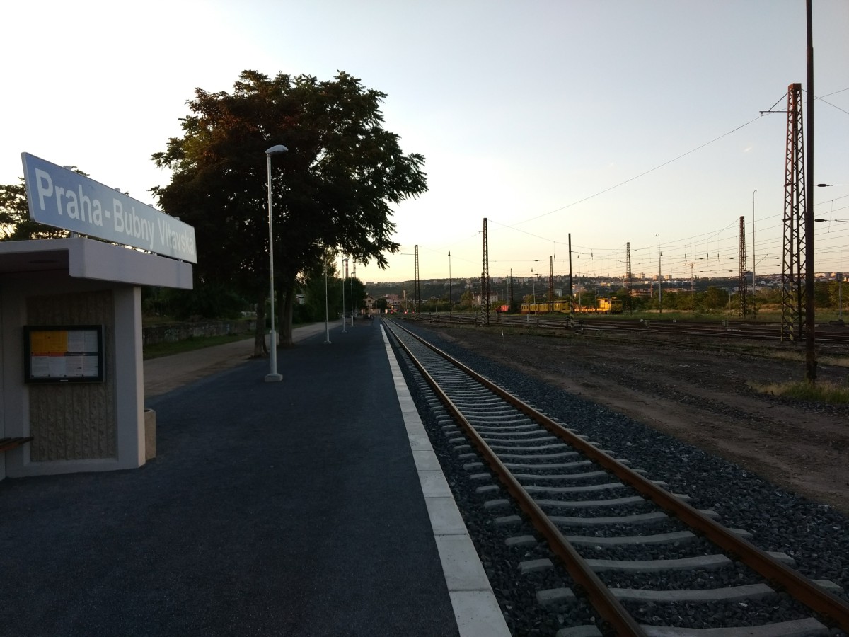 Small prefabricated concrete shack and the single track with a platform of the stop.