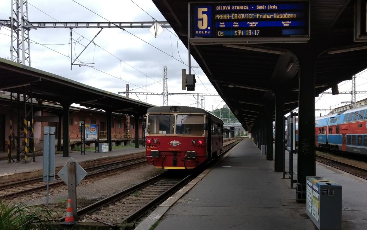 KŽC 810 railbus with historic markings on a track in Masarykovo nádraží.